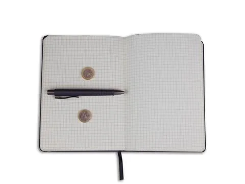 Closeup shot of a notebook with a pen and two coins isolated on white background Stock Photos