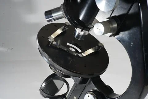 Closeup shot of an old black microscope Stock Photos