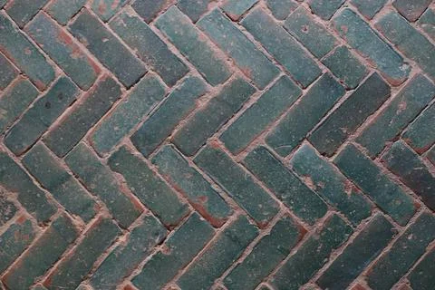 Closeup shot of old gray interlocking paving stones texture background 스톡 사진
