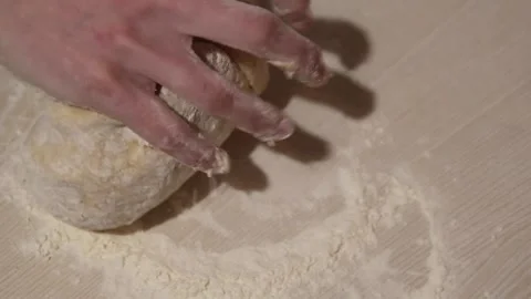 Closeup shot of one hand of young woman kneading dough Stock Footage 239793318