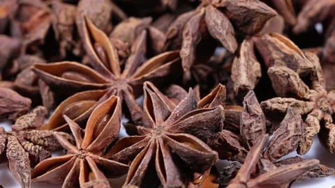 Closeup shot over a pile of star anise Stock Footage