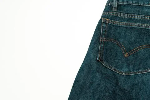 Closeup shot of a patch pocket of blue jeans on white background Stock Photos