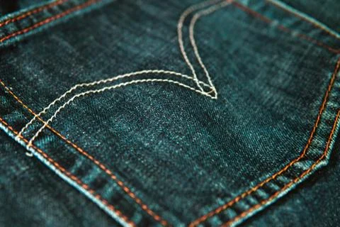 Closeup shot of a patch pocket of blue jeans Stock Photos
