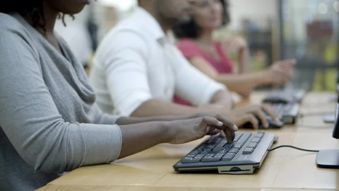Closeup shot of people working with computers at tables 스톡 동영상 116776387