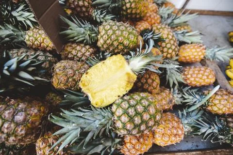 Closeup shot of pineapples on top of each other with a blurred background Stock Photos