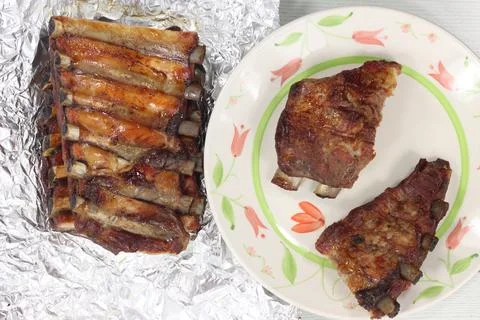 Closeup shot of pork ribs and potato croquettes Stock Photos