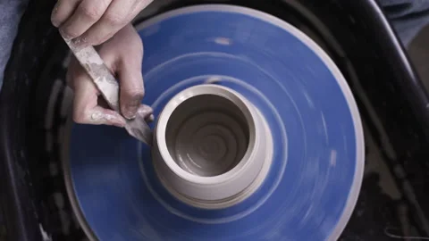 Closeup shot of potter's hands and clay Stock Footage 235465997