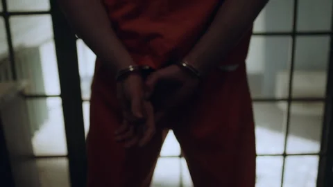 Closeup shot of prisoner's hands in cuffs Stock Footage 283087430