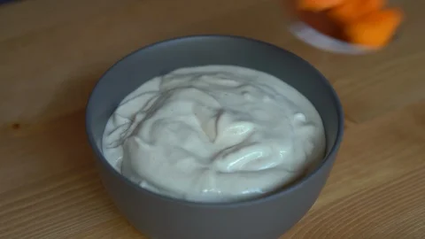 Closeup shot of a process of making a smoothie bowl with papaya, dragon fruit Stock Footage 108060183