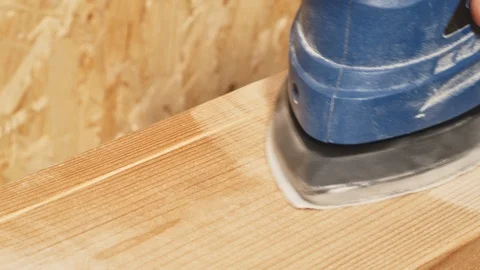 Closeup Shot of  the Process of Smoothening Hardwood Stock Footage 112079155