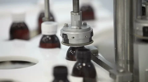  Closeup Shot of a Production Machine Fixing Bottle Caps Stock Footage 61868369
