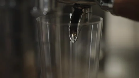 Closeup shot of pulling an espresso shot from coffee machine Stock Footage 348140945