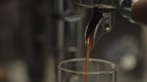 Closeup shot of pulling an espresso shot from coffee machine Stock Footage 348142791