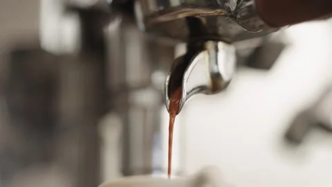 Closeup shot of pulling an espresso shot from coffee machine Stock Footage 348192989