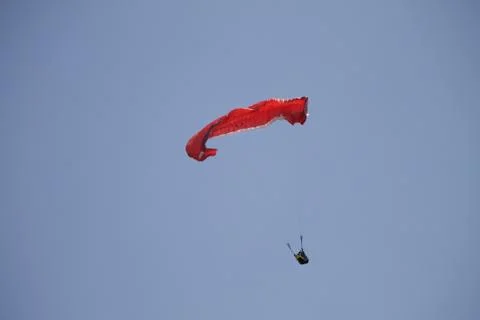 Closeup shot of a red paraplane on an empty sky Foto stock