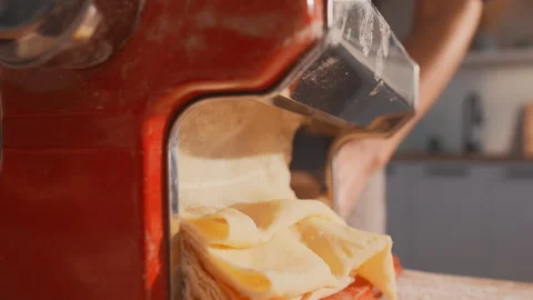 Closeup shot of rolling out the dough preparing homemade pasta Stock Footage 248174456
