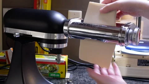 Closeup shot of rolling out the dough preparing homemade pasta 스톡 동영상 272601060