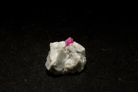 Closeup shot of a Ruby stone isolated on a black background Stock Photos