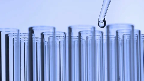 Closeup shot of scientist dripping liquid into test tube Stock Footage 115683095