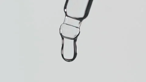 Closeup shot of scientist dripping liquid on white background, Slow motion Stock Footage 338094450