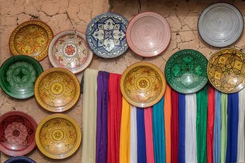 A closeup shot of several plates of different colors and patterns put next to Foto stock