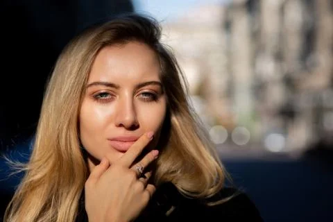 Closeup shot of sexy model with natural makeup posing with soft sun light and Stock Photos