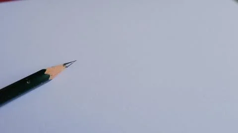 Closeup shot of a sharp pencil on the paper. Stationery goods 写真素材