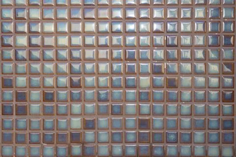 Closeup shot of a shiny squared pattern wall Stock Photos