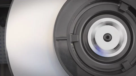 Closeup shot showing inside of a dvd player while a dvd is being inserted. Stock Footage 155613834