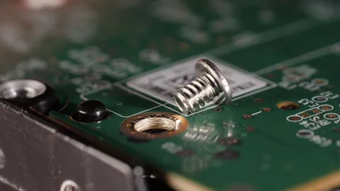 Closeup shot showing a microchip of a hard drive and a screw. Selective focus. Stock Footage 277839258