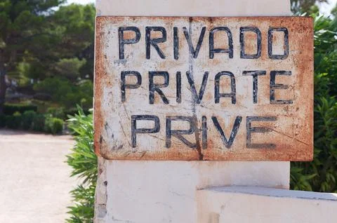Closeup shot of a sign with text Privado Private Prive in the Alicante province, Stock Photos