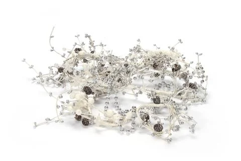 A closeup shot of silver string beads with pine cones isolated on white backg 스톡 사진