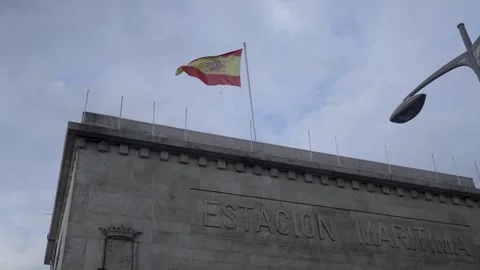 Closeup shot of the Spanish flag against a cloudy sky. Stock Footage 327624699