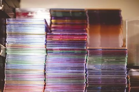 Closeup shot of a stack of CDs on a blurred background 写真素材