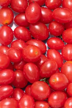 Closeup shot of a stack of juicy red cherry tomatoes. 스톡 사진
