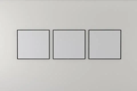 Closeup shot of three black frames on a white wall Foto stock