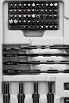 Closeup shot of a toolset with bit drivers, wrenches, and sockets Stock Photos