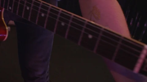 Closeup shot tracking down electric guitar Stock Footage 127103510