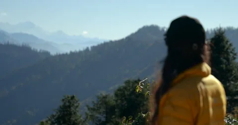 Closeup shot of trekker reading a map against Himalayan mountain backdrop Stock Footage 344709335
