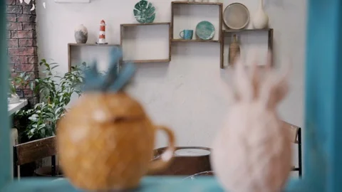 Closeup shot of two hipster pineapple fruit shaped pottery cup pot Video stock 119400591