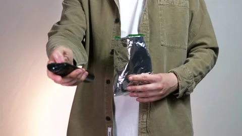 Closeup shot of unrecognizable man holding remote control Stock-Footage 312282501