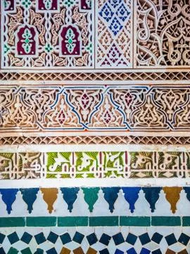 A closeup shot of a wall having different patterns of multiple colors painted Foto stock