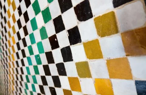 Closeup shot of a wall having square patterns of multiple colors painted on i 스톡 사진