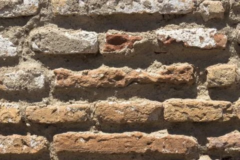 Closeup shot of a wall made up of rectangular stones Stock Photos