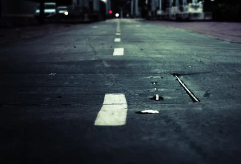 Closeup shot of white dashed line on the ground Stock Photos