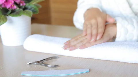 Closeup shot of a woman using a cuticle pusher to give a nail manicure. Nail Stock Footage 67853053