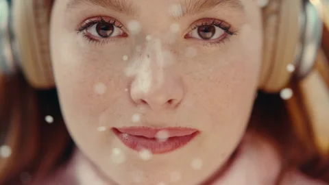 Closeup shot of a woman's face and particles flying Stock Footage 275595589