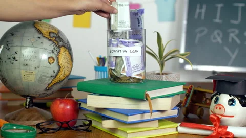 Closeup shot - Woman's hand adding money in a jar with "Education loan" label Vídeo Stock 156231846
