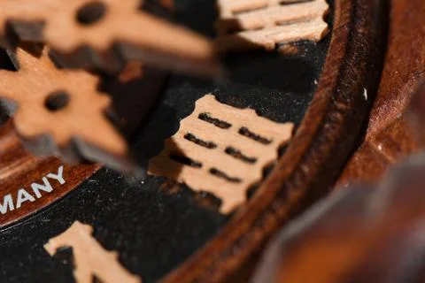Closeup shot of wooden clock pointers with interesting patterns Foto stock