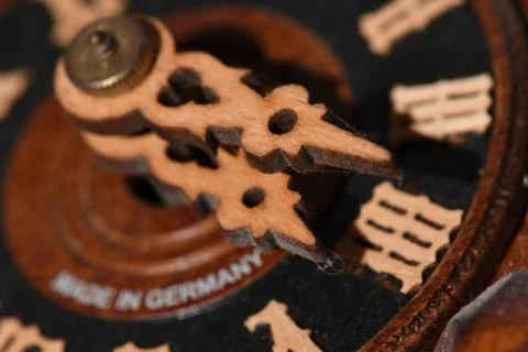 Closeup shot of wooden clock pointers with interesting patterns Foto stock